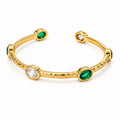 Bracciale rigido River - acciaio inossidabile placccato oro 18k PVD - zirconi che vanno dal trasparente al verde